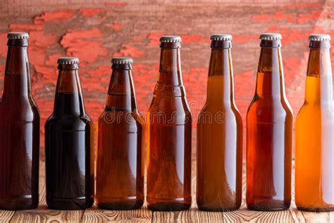 Row of Seven Types of Beer in Different Bottles Stock Image - Image of alcohol, alcoholic: 120178921