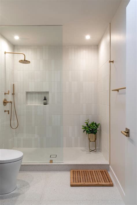 Two Bathrooms In The Same Home That Each Have A Distinct Style