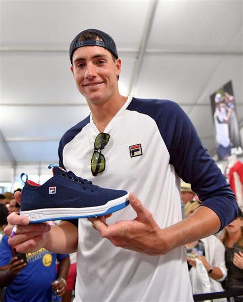 John Isner (wearing Fila Heritage) checks out their latest special edition tennis shoe. | Tennis ...