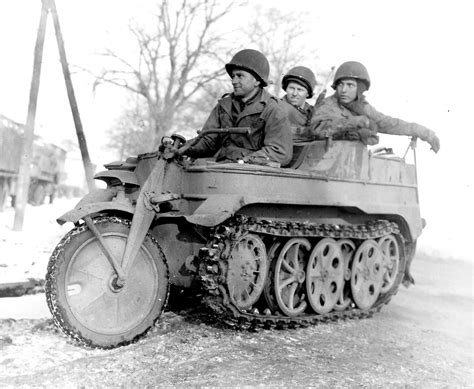 US sappers of the 327th Battalion, 102nd Infantry Division on captured German half-track ...