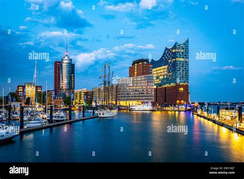 Port of Hamburg night view with three modern tower buildings including Elbphilharmonie. Photo ...