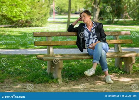 Alone Bench Or Chair At The Public Park Call Lumpini Park In The Thai ...