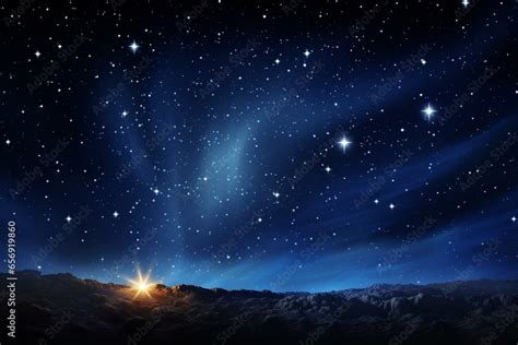 Bright nativity star over Bethlehem in a dark starry sky with a beam ...