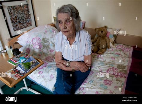 Sad elderly woman in care home Stock Photo - Alamy