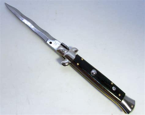 Sold Price: 9" ITALY INOX SWITCHBLADE AUTOMATIC KNIFE - March 6, 0119 10:00 AM EDT