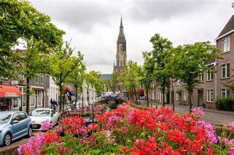 Delft Canals and New Church Tower, Netherlands Editorial Stock Photo ...