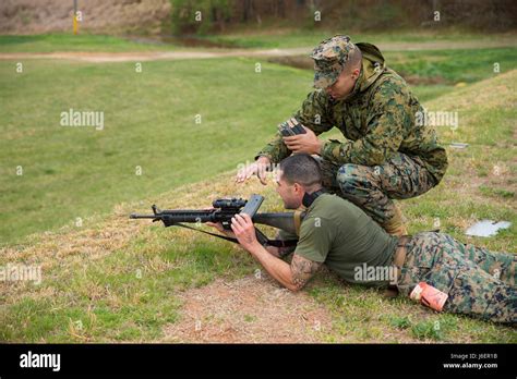 A U.S. Marine with Weapons Training Battalion (WTBn) clears the M16A4 ...