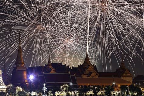 BANGKOK : Fireworks explode over the Grand Palace during the New Year celebrations, in Bangkok ...