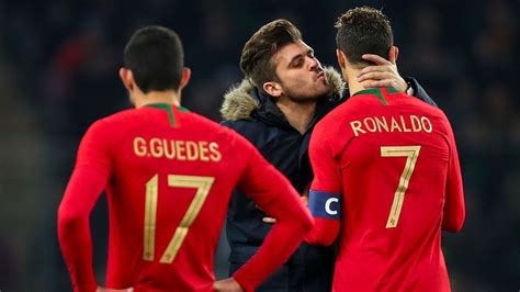 Watch Cristiano Ronaldo get kiss from pitch-invading Portugal fan