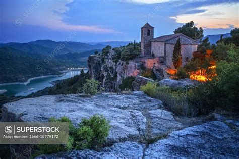 Siurana medieval village with romanesque church of Santa Maria de Siurana and the Siurana Lake ...