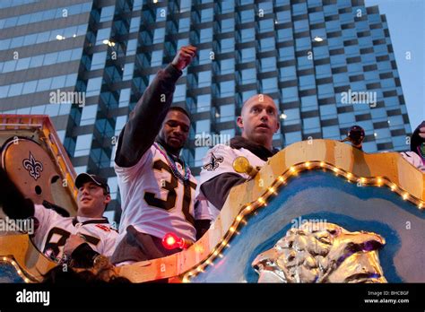 New Orleans Saints football players riding a float in the Saints ...