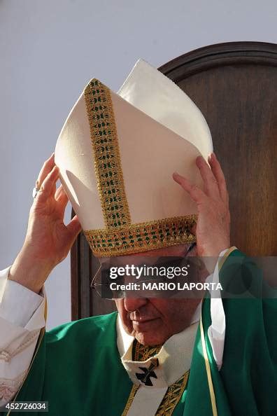 Pope Francis adjusts his mitre during mass at Piazza Carlo III during ...