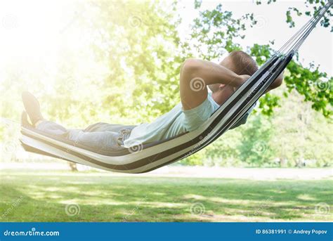 Man Relaxing in Hammock stock image. Image of relax, nature - 86381991