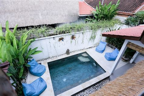 Premium Photo | The pool at the villa ubud