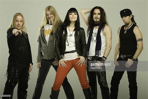 Posed studio group portrait of Finnish metal band Nightwish. Left to ...