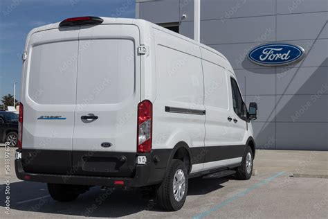 Ford E-Transit Cargo Van display at a dealership. Ford offers the E-Transit in Cargo Van ...