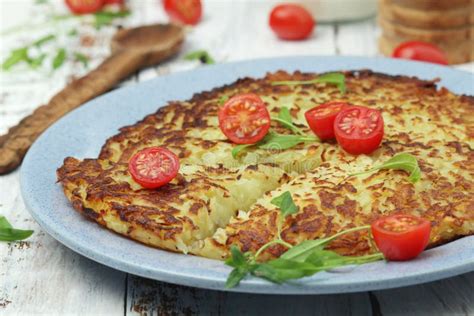 Rosti - Swiss Dish Made of Grated Potato Stock Image - Image of ...