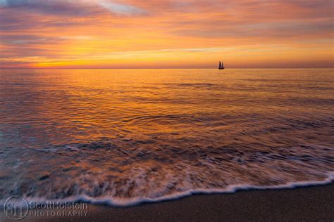 A Pastel Sunset and a Sailboat Off of a Florida Beach - Landscape Photography