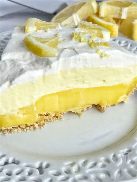 a slice of lemon pie on a white plate