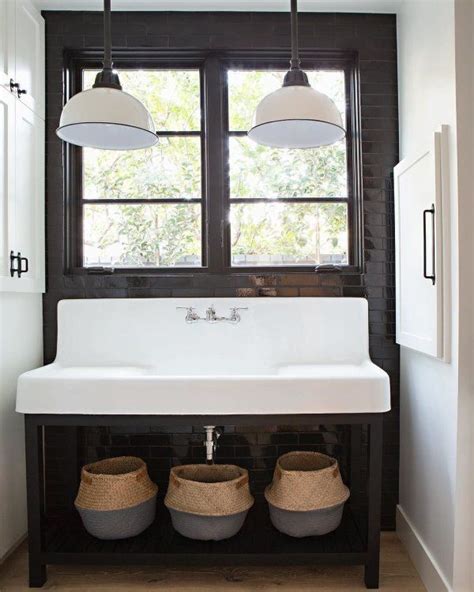 What a cool space with the trough sink and farmhouse light fixtures ...