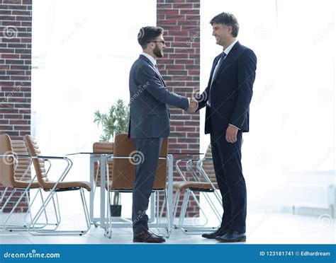 Two Business People Shake Hands in the Office Stock Image - Image of background, colleagues ...