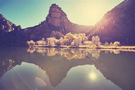 Beautiful Mountain Lake at Sunrise with Lens Flare Effect. Stock Image - Image of sunrise, lake ...