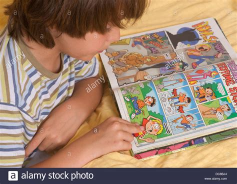 kid kids boy child children learning to read reading comic book Beano Stock Photo, Royalty Free ...