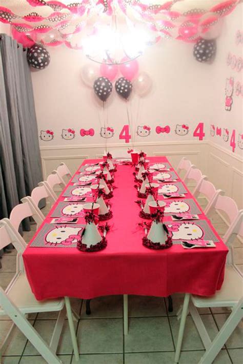 a table set up for a hello kitty birthday party