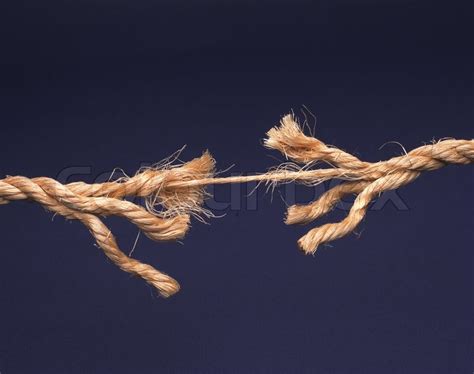 Frayed rope about to break isolated on ... | Stock image | Colourbox