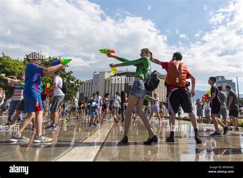 Water gun fight summer Stock Photo - Alamy