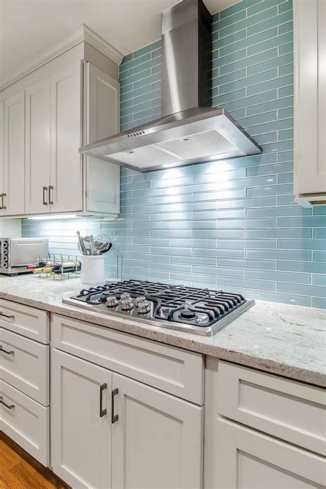 Stainless Steel Cooktop and Range Hood With Blue Backsplash | Blue backsplash kitchen, Glass ...