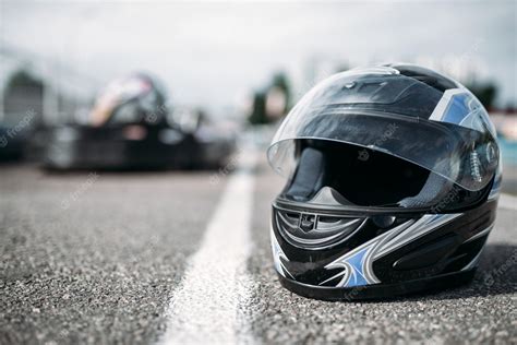 Premium Photo | Racer helmet on asphalt, karting motor sport concept ...