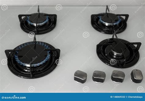 Gas Burners with Blue Flame on Stove Stock Photo - Image of appliance ...