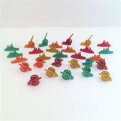 These vibrantly color cast metal board game tokens came from a 1960's ...