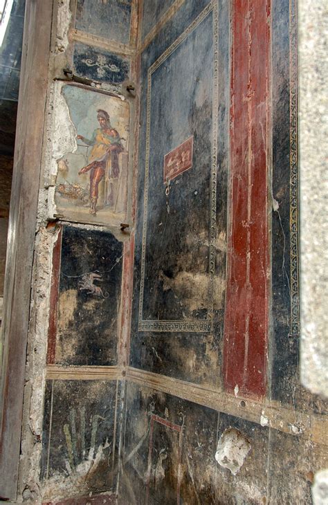 Fauces of the House of the Vettii: frescoes to the right of the entrance. Pompeii ...