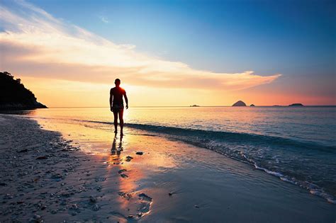 Contemplation on the tropical beach - Lonely man walking on the tropical beach during amazing ...
