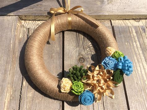 Jute wreath with felt and ribbon flowers | Ribbon flowers, Flowers, Wreaths