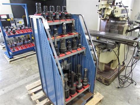 Machines Used | (30) Cat 50 Tool Holders with Rack. Assorted Styles