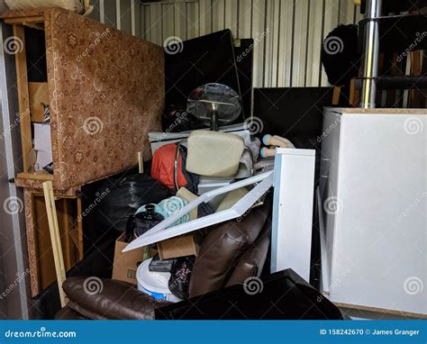 A Self Storage Unit Full of Stored Household Junk Items Stock Photo ...