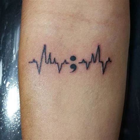 Popularly known as the EKG line tattoo, the pulse symbol is similar to ...