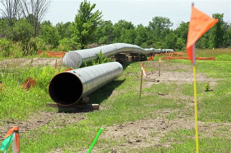 Oil Pipeline Construction Photograph by Jim West - Pixels