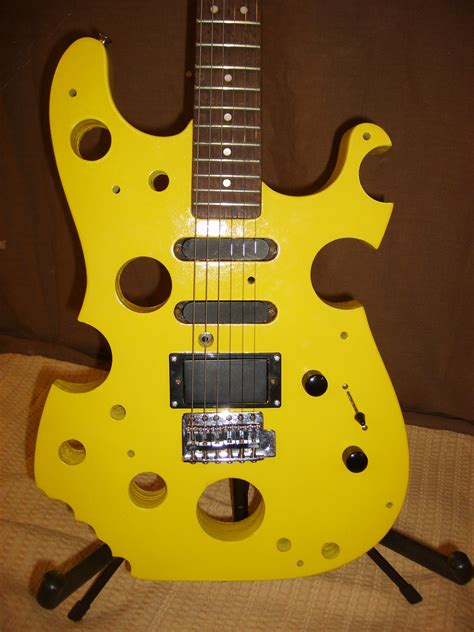 Officially the cheesiest guitar around. | Electric guitar design, Guitar design, Cool guitar