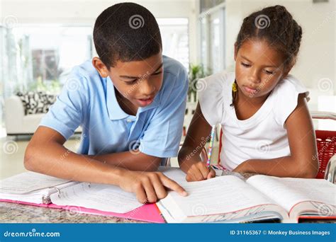 Two Children Doing Homework in Kitchen Stock Image - Image of education, girl: 31165367