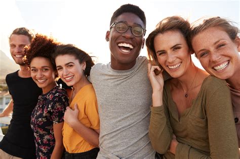 Portrait,Of,Smiling,Young,Friends,Walking,Outdoors,Together