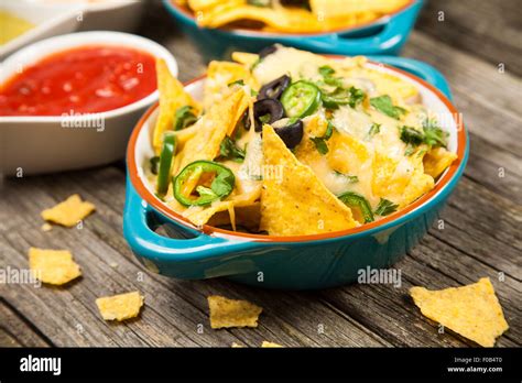 Nachos with melted cheese Stock Photo - Alamy