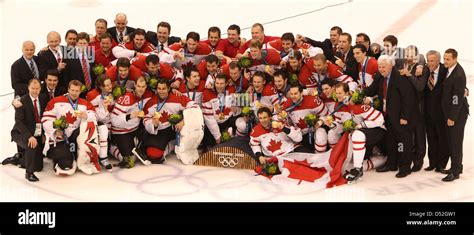 Team of Canada celebrate with their gold medals after Mens' Ice Hockey final match against USA ...