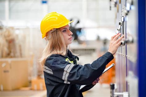 Inside a Factory, Industrial Worker in Action on Machine. Stock Photo ...