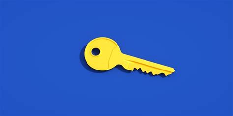 Premium Photo | A yellow key on a blue background