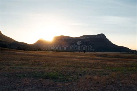 Sunset Sunbeams Sunburst As they Hit the Mountain Edge Stock Image ...