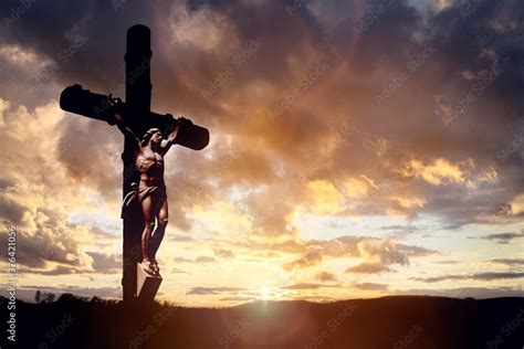 Crucifix cross at sunset background, crucifixion of Jesus Christ Stock Photo | Adobe Stock